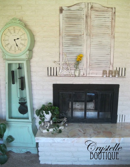 CrystelleBoutique - White shutters with shelf above the fireplace