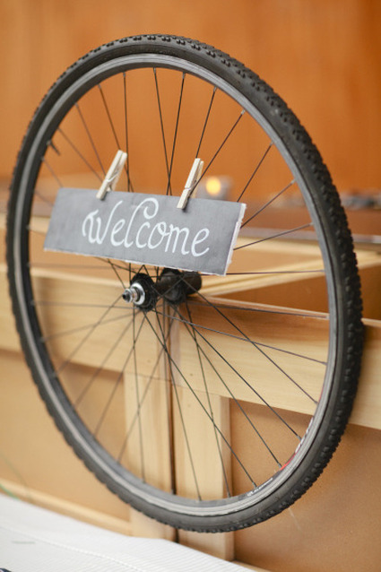 Welcome Sign on Bike Wheel by Style Me Pretty