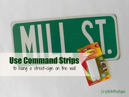 CrystelleBoutique - tip - use command strips to hand a street-sign on the wall