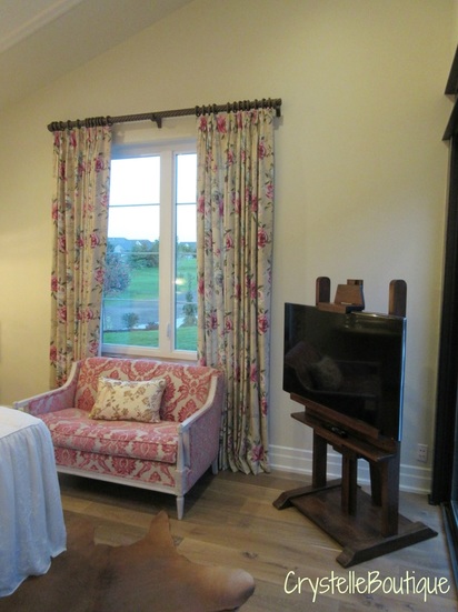Fabulous floral print combinations in the settee, pillow, and drapes....