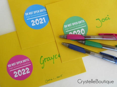 Cyrstelleboutique.com –time capsule info envelopes – one for each girl, with their name and date added