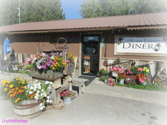CrystelleBoutique - the Rusty Lantern Diner - In the summer time the rusty junk in the flower beds are covered with gorgeous luscious  flowers.